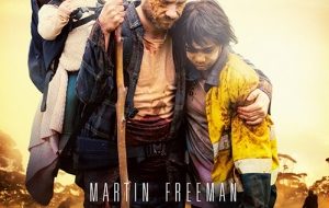 Martin Freeman, Thoomi, and his daughter on a plain.